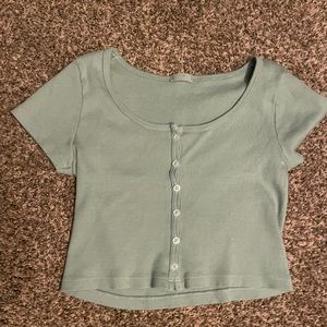 I’m selling a Green brandy Melville button up crop